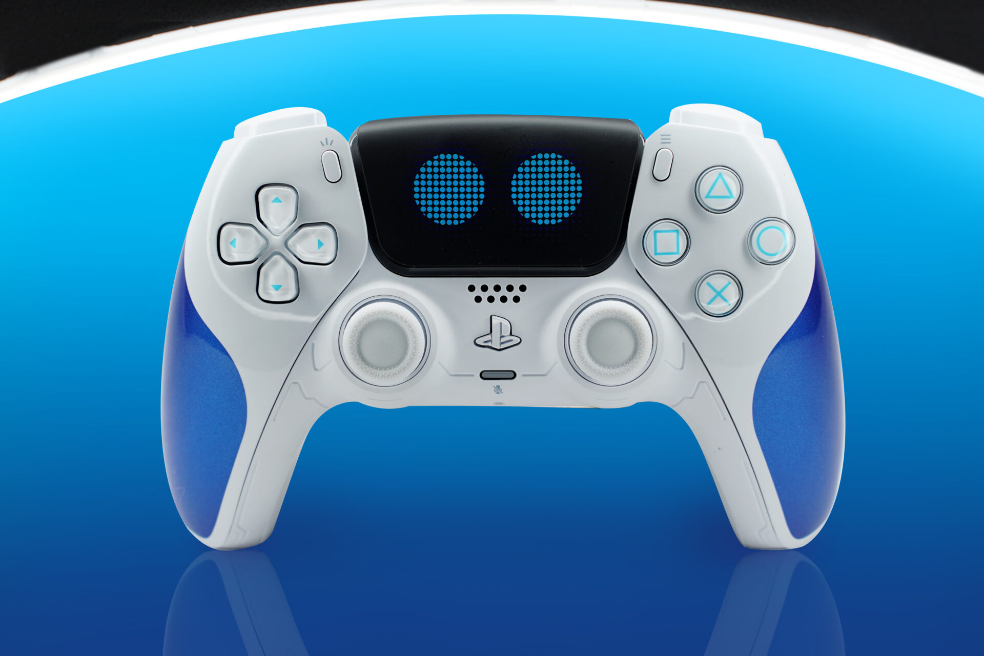 Astrobot Controller - 4 copy PS5 Controller blue and white with circular blue eyes. Astrobot ps5 controller